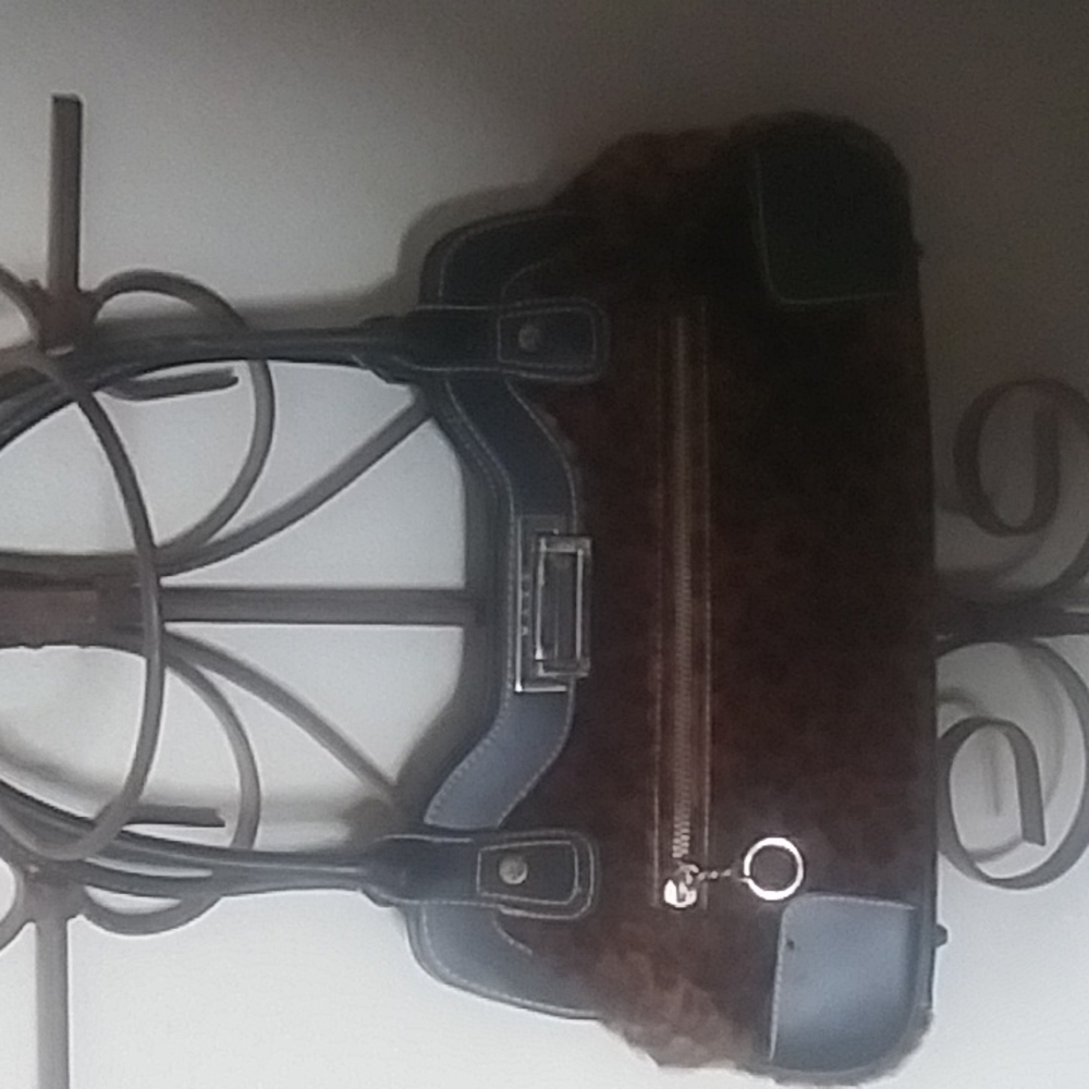 Leopard and black Maxx New York handbag.